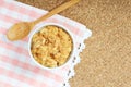 dried pork floss in white cup with wooden spoon on corkboard background. Royalty Free Stock Photo