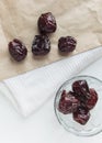 Dried prune in glass bowl and paper bag