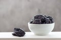 Dried prunes in a white bowl Royalty Free Stock Photo