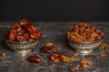 Dried raisins of grapes and dates in a medium-sized cup c. Royalty Free Stock Photo