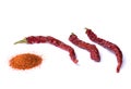 Dried red chili pepper on white background. Desiccated milled paprika.