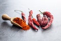 Dried red chili peppers and chili powder Royalty Free Stock Photo