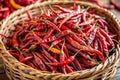 Dried Red Chilies in a Rustic Woven Basket Royalty Free Stock Photo