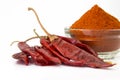 Dried red chilli and chilli powder Royalty Free Stock Photo