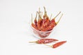 Dried red chillies in a glass cup on a white background Royalty Free Stock Photo