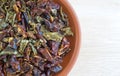 Dried red and green bell peppers in a small bowl