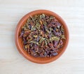 Dried red and green bell peppers in a small bowl