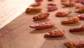 Dried red hot cayenne piripiri peppers on a wooden surface