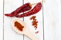 Dried red hot chili peppers on a wooden white background. Flat l Royalty Free Stock Photo