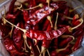 Dried red hot chili on wooden plate, Food ingredient for spicy recipe.