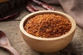 Dried red hot chilli powder in wooden bowl.Hot and spicy asian Condiments Royalty Free Stock Photo