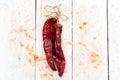 Dried red hot pepper on a white wooden background. Flat lay Royalty Free Stock Photo