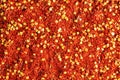 Dried red pepper powder. Background of crushed dry chili peppers Royalty Free Stock Photo