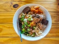 Dried Rice Porridge with Pork on the wooden table, top view