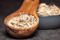 Dried root of siberian ginseng on dark background - medicine alternative Royalty Free Stock Photo