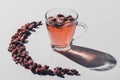 dried rose buds tea in cup and reflecting shadow Royalty Free Stock Photo
