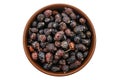 Dried rose hips in wooden bowl