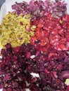 Dried Rose Petals in Shades of yellow, pink, red, and crimson Royalty Free Stock Photo