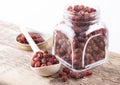 Dried rosehip berries in glass jar