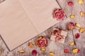 Dried roses and an open book. Paper background. Romantic background. Gift box Royalty Free Stock Photo