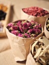 Dried roses, tea ingredients, in the raw bag and white background