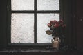 Dried flowers in a vase on an old window sill Royalty Free Stock Photo