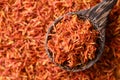 Dried safflower in spoon