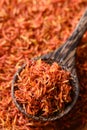 Dried safflower in spoon