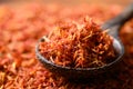 Dried safflower in spoon