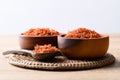 Dried safflower in wooden bowl and spoon