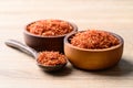 Dried safflower in wooden bowl and spoon