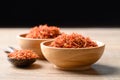 Dried safflower in wooden bowl and spoon