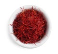 Dried saffron in bowl isolated on white, top view Royalty Free Stock Photo
