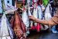 Dried salted fish hung with straw ropes for sale on a motorcycle trailer beside the sea, Rayong Royalty Free Stock Photo