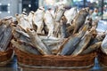 Dried salted perch fish in basket close up, dry sea bass sale on seafood market, tasty stockfish, jerky grouper, salty sunfish Royalty Free Stock Photo