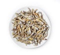 Dried sardines used as seasoning in Japanese foods and cooking on white background.