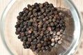 Dried seeds black pepper Piper nigrum on the kitchen table. Ingredient for spices. Culinary background texture. Top view