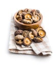 Dried shiitake mushrooms on checkered napkin isolated on white background Royalty Free Stock Photo