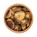 Dried shiitake mushrooms, Lentinula edodes, in a wooden bowl