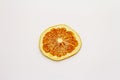 Dried single slice of grapefruit isolated on white background Royalty Free Stock Photo