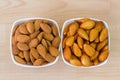 Dried and soaked Shelled Almond on wooden background