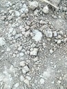 Dried soil cracked texture and stone closeup Royalty Free Stock Photo