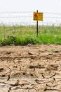 Dried soil and flowered minefield Royalty Free Stock Photo