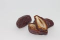 Dried split date fruit. Dried dates isolated on white background. Best of Ramadan food