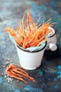 Dried squid tentacles snack with hot spices in a ceramic bucket Royalty Free Stock Photo