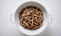 Dried sticks of Indian ginseng in a white bowl Royalty Free Stock Photo