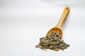 Dried sunflower seeds in the wooden spoon on white background Royalty Free Stock Photo