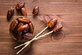 Dried sweet dates fruit in the bowl, chopsticks for eating Royalty Free Stock Photo