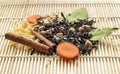 Dried tea, pasta, carrot and spices on wood background, front view