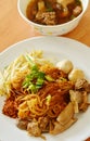 Dried thin rice noodle topping braised pork and brown bone soup